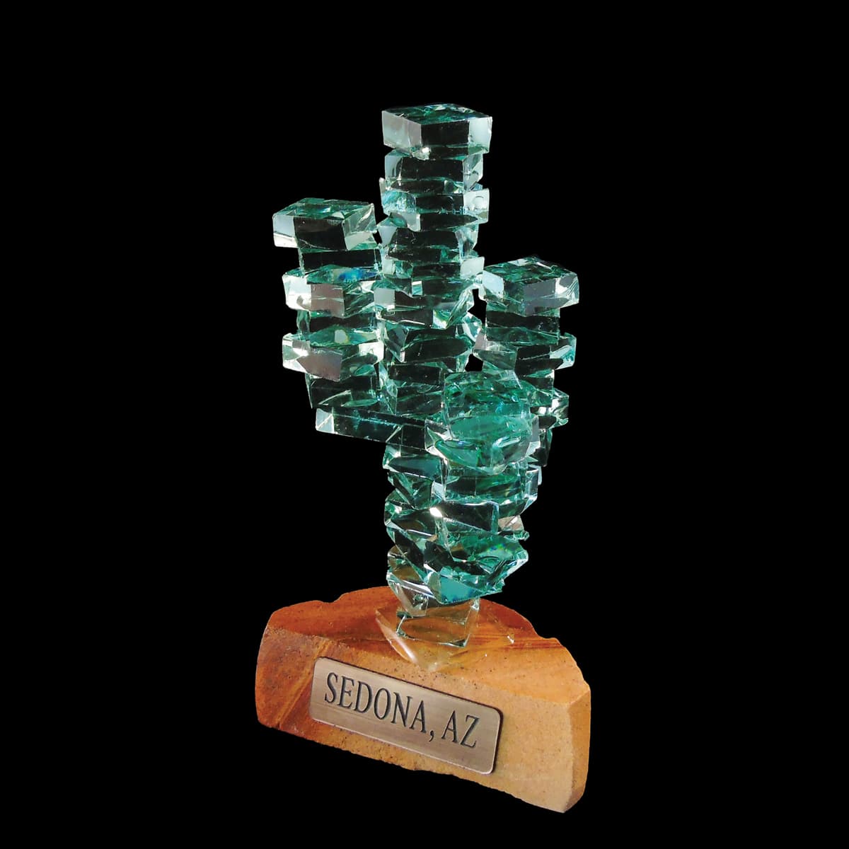 Glass saguaro cactus on sandstone pedestal