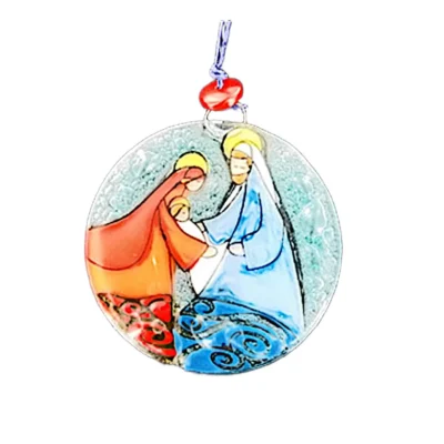 Clear textured glass Nativity ornament depicting Mary in orange and red robes, Joseph in blue robes, and baby Jesus with yellow halos.