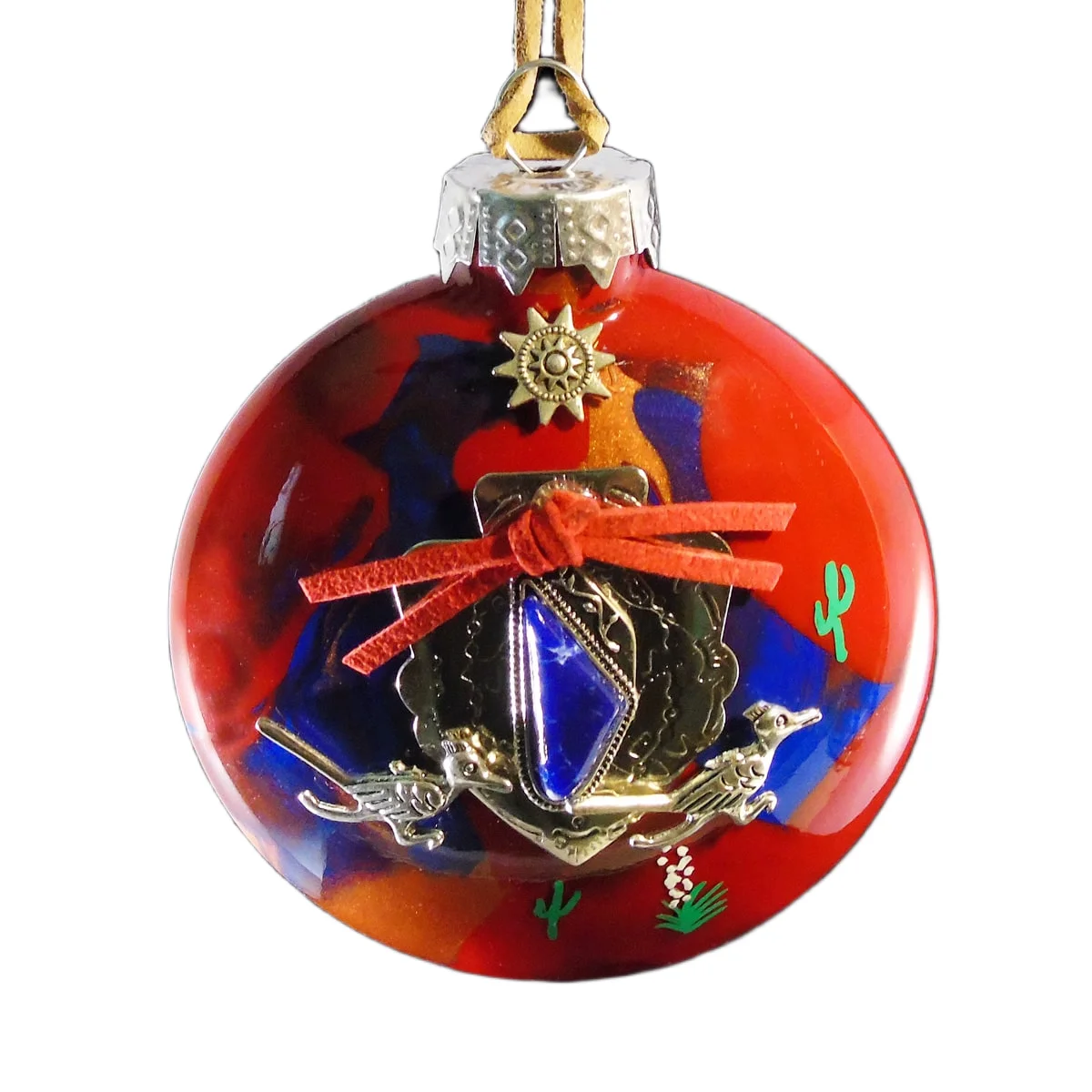 Red and blue glass Southwest ornament featuring a lapis-style stone concho charm with red suede tie, silver roadrunners, and sun emblem.
