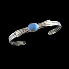 This Navajo sterling silver cuff bracelet features a rare Golden Hill Turquoise stone