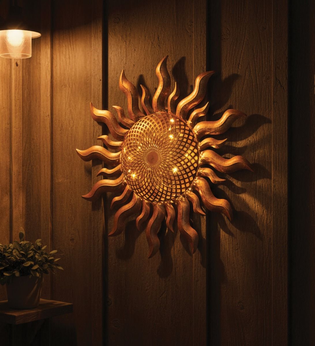 Warm-toned sunburst wall light on a wooden wall, with a small potted plant to the left.